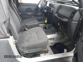 2006 Jeep Wrangler Sport with VIN 1J4FA49S46P748604, listed as a IAAI auction lot 41788157 with 128,249 mi miles. Bid and sale history available at carsss.com. Image 5.