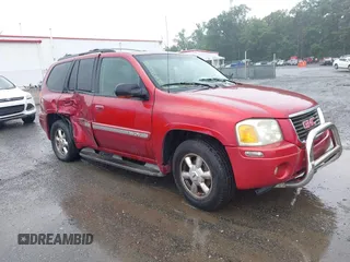 2003 GMC Envoy SLE z VIN 1GKDT13S732364151, wystawiony jako IAAI lot #42425405 z przebiegiem Nie podano mil oraz . Historia ofert i sprzedaży dostępna na DreamBid. Obrazek 1.