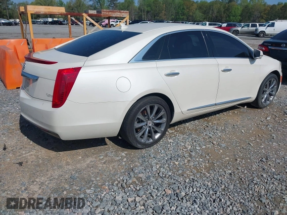 2014 Cadillac XTS with VIN 2G61L5S3XE9231858, listed as a IAAI auction lot 41941564 with 158,479 mi miles. Bid and sale history available at carsss.com. Image 4.
