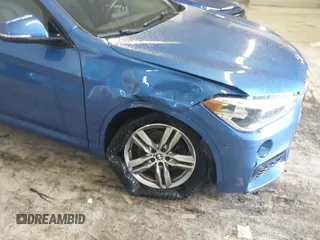 2019 BMW X1 xDrive28i with VIN WBXHT3C53K5L36690, listed as a IAAI auction lot 42012992 with 70,339 mi miles. Bid and sale history available at carsss.com. Image 6.
