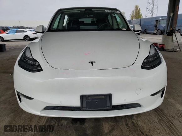 2022 Tesla Model Y Long Range z VIN 7SAYGAEE9NF493262, wystawiony jako Copart lot #52975005 z przebiegiem 63 189 mil mil oraz Szkoda całkowita • Salvage title. Historia ofert i sprzedaży dostępna na DreamBid. Obrazek 5.