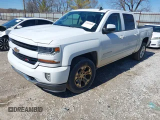 2017 Chevrolet Silverado 1500 LT with VIN 3GCUKREC3HG489701, listed as a IAAI auction lot 41814860 with 218,605 mi miles. Bid and sale history available at carsss.com. Image 2.
