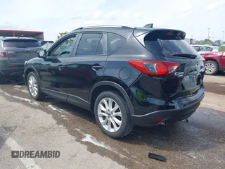 2013 Mazda CX-5 Grand Touring with VIN JM3KE4DE6D0148030, listed as a IAAI auction lot 42082947 with 119,432 mi miles and . Bid and sale history available at DreamBid. Image 3.