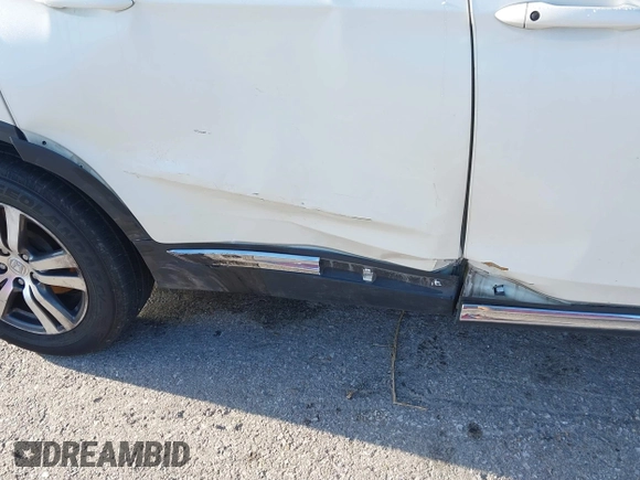 2017 Honda Pilot EX-L with VIN 5FNYF6H54HB015814, listed as a IAAI auction lot 41955743 with 122,389 mi miles and . Bid and sale history available at DreamBid. Image 6.
