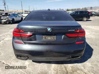 2019 BMW 7 Series 750i with VIN WBA7F0C56KGM25430, listed as a Copart auction lot 42048135 with 74,717 mi miles and Salvage title. Bid and sale history available at DreamBid. Image 6.