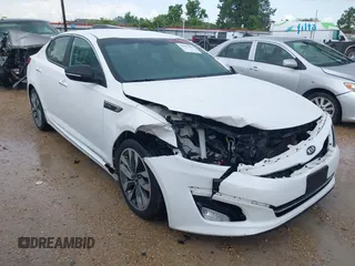 2015 Kia Optima SX Turbo z VIN 5XXGR4A68FG453580, wystawiony jako IAAI lot #42491863 z przebiegiem 127 003 mil mil oraz . Historia ofert i sprzedaży dostępna na DreamBid. Obrazek 1.