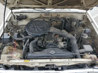 1988 Toyota Pickup z VIN JT4RN50R0J5122639, wystawiony jako Copart lot #52792445 z przebiegiem 233 407 mil mil oraz Szkody całkowita. Historia ofert i sprzedaży dostępna na DreamBid. Obrazek 11.