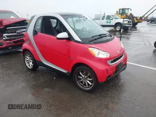 2009 Smart fortwo Pure with VIN WMEEJ31X59K254080, listed as a IAAI auction lot 41490165 with 47,393 mi miles. Bid and sale history available at carsss.com. Image 1.
