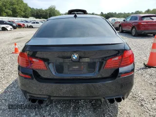 2016 BMW M5 z VIN WBSFV9C55GD595799, wystawiony jako Copart lot #65708864 z przebiegiem 104 198 mil mil oraz Szkoda całkowita • Salvage title. Historia ofert i sprzedaży dostępna na DreamBid. Obrazek 6.