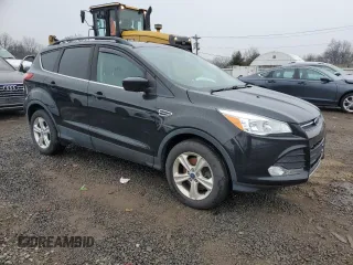 2014 Ford Escape SE with VIN 1FMCU9GX2EUA26491, listed as a Copart auction lot 43094275 with 129,174 mi miles and Clean Title. Bid and sale history available at DreamBid. Image 4.
