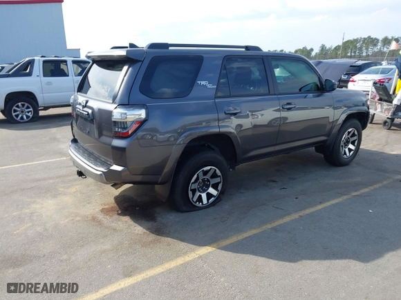 2021 Toyota 4Runner TRD Off Road with VIN JTEPU5JR0M5877962, listed as a IAAI auction lot 41683297 with 61,539 mi miles. Bid and sale history available at carsss.com. Image 4.