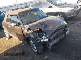 2011 MINI Convertible with VIN WMWZN3C55BT133367, listed as a IAAI auction lot 41781374 with 124,036 mi miles and . Bid and sale history available at DreamBid. Image 1.