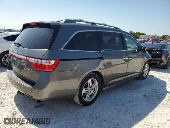 2011 Honda Odyssey Touring with VIN 5FNRL5H97BB501213, listed as a Copart auction lot 57314115 with 283,538 mi miles and Salvage title. Bid and sale history available at DreamBid. Image 3.