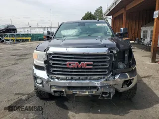 2015 GMC Sierra 2500HD SLT with VIN 1GT12ZE85FF589148, listed as a Copart auction lot 51329515 with 194,378 mi miles and Salvage title. Bid and sale history available at DreamBid. Image 5.
