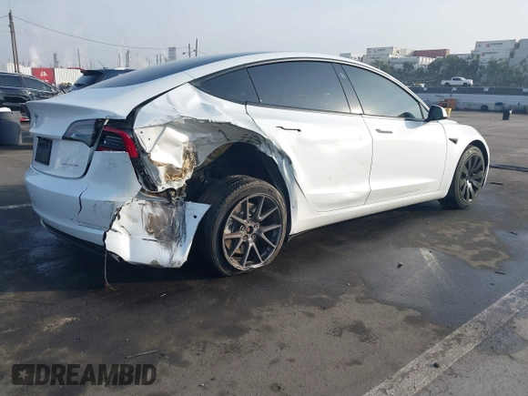 2021 Tesla Model 3 Long Range with VIN 5YJ3E1EB0MF009965, listed as a IAAI auction lot 41478233 with 31,713 mi miles and . Bid and sale history available at DreamBid. Image 4.