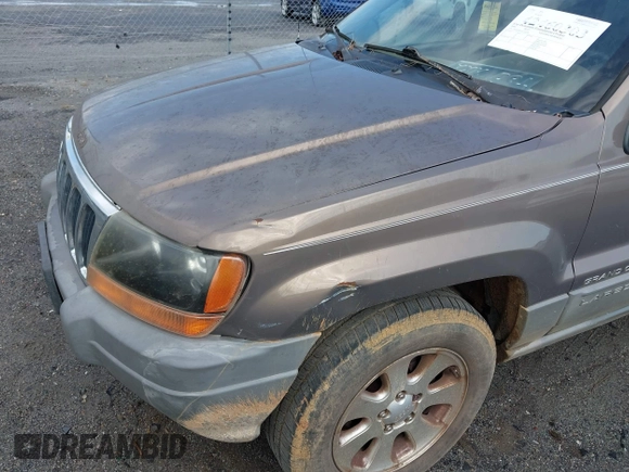 2001 Jeep Grand Cherokee Laredo z VIN 1J4GX48N51C548958, wystawiony jako IAAI lot #42460303 z przebiegiem 210 379 mil mil oraz . Historia ofert i sprzedaży dostępna na DreamBid. Obrazek 6.