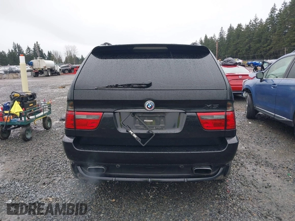 2005 BMW X5 4.8is with VIN 5UXFA93515LE82570, listed as a IAAI auction lot 41759657 with 212,687 mi miles. Bid and sale history available at carsss.com. Image 16.