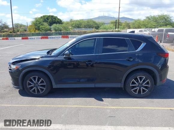 2018 Mazda CX-5 Touring z VIN JM3KFACM5J0309533, wystawiony jako IAAI lot #42195429 z przebiegiem 91 928 mil mil oraz . Historia ofert i sprzedaży dostępna na DreamBid. Obrazek 14.