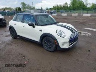 2015 MINI Hardtop 4 Door with VIN WMWXS5C52FT831291, listed as a IAAI auction lot 42179801 with 63,261 mi miles and . Bid and sale history available at DreamBid. Image 1.
