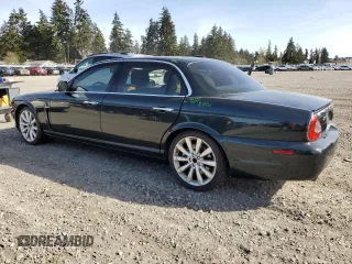 2008 Jaguar XJ with VIN SAJWA79BX8SH23430, listed as a Copart auction lot 51990785 with 140,454 mi miles and Salvage Title. Bid and sale history available at carsss.com. Image 2.
