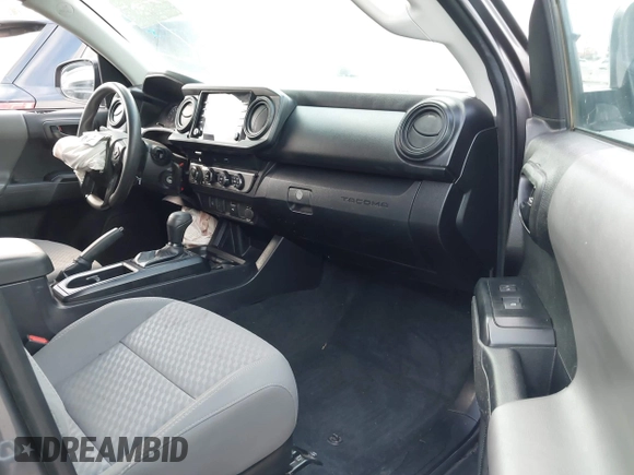 2022 Toyota Tacoma SR with VIN 3TYSX5EN8NT016817, listed as a IAAI auction lot 42140136 with 52,825 mi miles and . Bid and sale history available at DreamBid. Image 5.