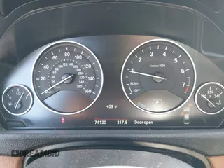 2017 BMW 3 Series 330e iPerformance with VIN WBA8E1C34HA156688, listed as a IAAI auction lot 41753490 with 74,130 mi miles. Bid and sale history available at carsss.com. Image 7.