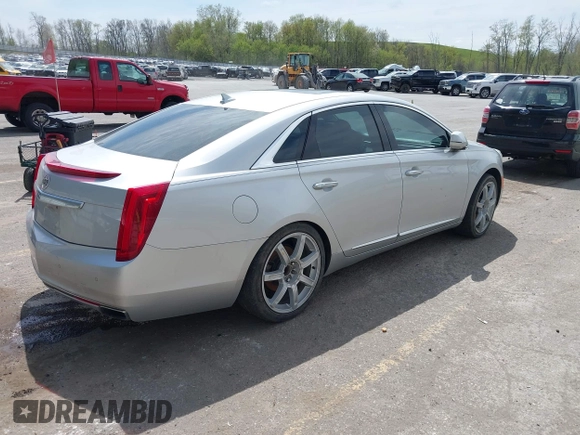 2013 Cadillac XTS Luxury z VIN 2G61P5S3XD9178601, wystawiony jako IAAI lot #42154859 z przebiegiem 111 227 mil mil oraz . Historia ofert i sprzedaży dostępna na DreamBid. Obrazek 4.