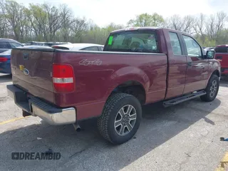 2005 Ford F-150 XLT with VIN 1FTPX14575KD79404, listed as a IAAI auction lot 42003073 with 212,050 mi miles. Bid and sale history available at carsss.com. Image 4.