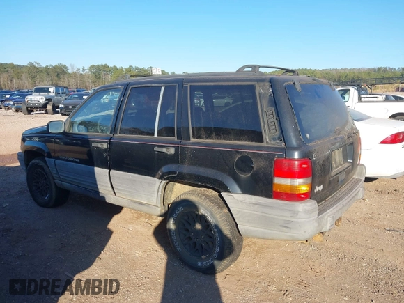 1998 Jeep Grand Cherokee Laredo with VIN 1J4FX58S7WC283734, listed as a IAAI auction lot 41267813 with 266,189 mi miles. Bid and sale history available at carsss.com. Image 6.