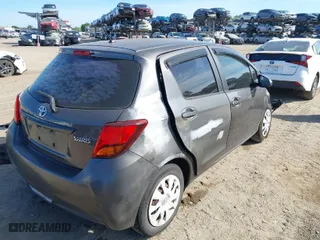 2015 Toyota Yaris L with VIN VNKKTUD31FA027763, listed as a IAAI auction lot 41886803 with 104,889 mi miles. Bid and sale history available at carsss.com. Image 4.