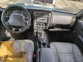 1999 Jeep Cherokee SE with VIN 1J4FF28S5XL646812, listed as a Copart auction lot 87951115 with 230,161 mi miles and Clean title. Bid and sale history available at DreamBid. Image 8.