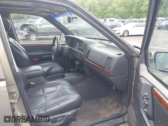 1998 Jeep Grand Cherokee Limited z VIN 1J4GZ78Y5WC261391, wystawiony jako IAAI lot #42275913 z przebiegiem 180 552 mil mil oraz . Historia ofert i sprzedaży dostępna na DreamBid. Obrazek 5.