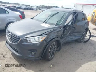 2016 Mazda CX-5 Grand Touring with VIN JM3KE4DY9G0845707, listed as a IAAI auction lot 41709685 with 96,351 mi miles. Bid and sale history available at carsss.com. Image 2.