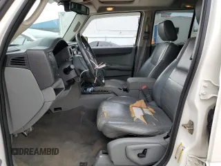 2006 Jeep Commander with VIN 1J8HH48N06C352871, listed as a Copart auction lot 87740115 with 163,703 mi miles and Salvage Title. Bid and sale history available at carsss.com. Image 7.