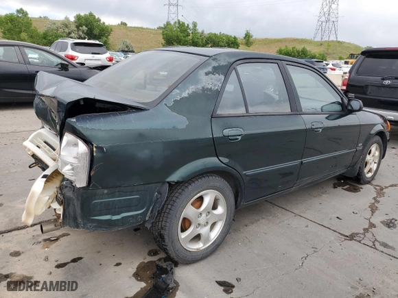 1999 Mazda Protege ES with VIN JM1BJ2210X0150711, listed as a Copart auction lot 57629144 with 175,754 mi miles and Salvage Title. Bid and sale history available at carsss.com. Image 3.