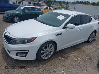 2015 Kia Optima SX Turbo with VIN 5XXGR4A61FG438242, listed as a IAAI auction lot 42344818 with 157,098 mi miles and . Bid and sale history available at DreamBid. Image 2.