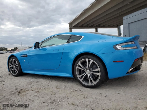 2011 Aston Martin V12 Vantage Carbon Black with VIN SCFEBBCF6BGS00579, listed as a Copart auction lot 79911294 with 34,191 mi miles and Salvage Title. Bid and sale history available at carsss.com. Image 2.