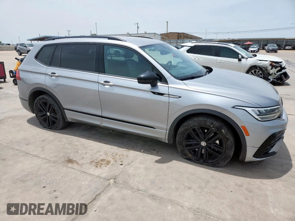 2022 Volkswagen Tiguan SE R-Line Black with VIN 3VVCB7AX5NM016910, listed as a Copart auction lot 57120005 with 54,812 mi miles and Salvage title. Bid and sale history available at DreamBid. Image 4.
