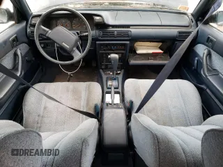1989 Toyota Camry z VIN JT2SV21E6K3335385, wystawiony jako Copart lot #82466934 z przebiegiem 74 815 mil mil oraz Czysty tytuł • Clean title. Historia ofert i sprzedaży dostępna na DreamBid. Obrazek 8.