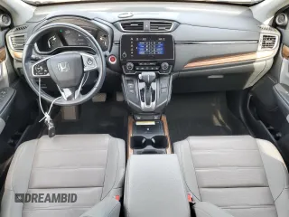 2020 Honda CR-V Touring with VIN 2HKRW2H99LH677964, listed as a Copart auction lot 61169915 with 65,915 mi miles and Salvage title. Bid and sale history available at DreamBid. Image 8.