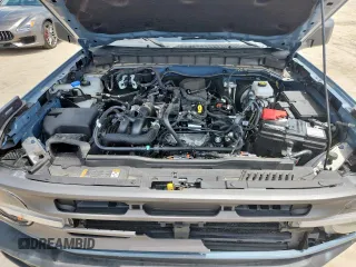 2024 Ford Bronco Big Bend with VIN 1FMDE7BH7RLA03788, listed as a Copart auction lot 65085065 with 10,597 mi miles and Salvage title. Bid and sale history available at DreamBid. Image 12.