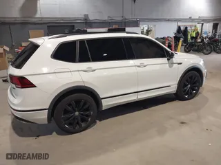 2020 Volkswagen Tiguan SE with VIN 3VV2B7AX1LM106600, listed as a IAAI auction lot 40259436 with 56,736 mi miles. Bid and sale history available at carsss.com. Image 4.