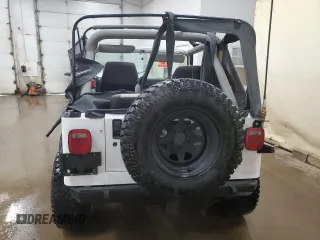 1990 Jeep Wrangler S with VIN 2J4FY19E8LJ541713, listed as a Copart auction lot 60809655 with 134,077 mi miles and Clean title. Bid and sale history available at DreamBid. Image 6.