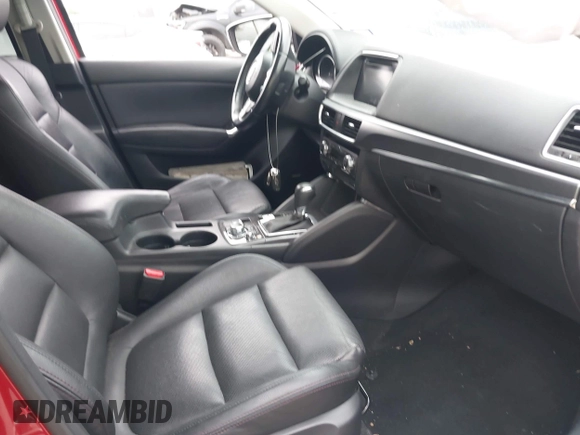 2016 Mazda CX-5 Grand Touring with VIN JM3KE2DY8G0871574, listed as a IAAI auction lot 41959686 with 95,416 mi miles and . Bid and sale history available at DreamBid. Image 5.