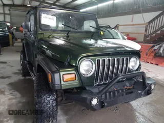 1998 Jeep Wrangler SE with VIN 1J4FY29P2WP733255, listed as a IAAI auction lot 41554602 with 157,316 mi miles. Bid and sale history available at carsss.com. Image 1.
