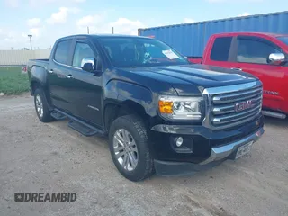 2016 GMC Canyon 4WD SLT z VIN 1GTG6DE39G1163841, wystawiony jako IAAI lot #42452639 z przebiegiem 653 191 mil mil oraz . Historia ofert i sprzedaży dostępna na DreamBid. Obrazek 1.