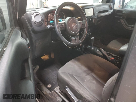 2017 Jeep Wrangler Willys Wheeler with VIN 1C4AJWAG9HL696710, listed as a Copart auction lot 88744905 with 66,800 mi miles and Salvage Title. Bid and sale history available at DreamBid. Image 8.