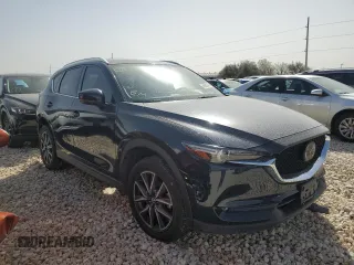 2018 Mazda CX-5 Grand Touring with VIN JM3KFBDM8J0474819, listed as a Copart auction lot 48580545 with 76,917 mi miles and Salvage Title. Bid and sale history available at DreamBid. Image 4.