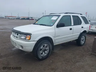 2001 Isuzu Rodeo S with VIN 4S2DM58WX14315138, listed as a IAAI auction lot 41535619 with 217,960 mi miles. Bid and sale history available at carsss.com. Image 2.