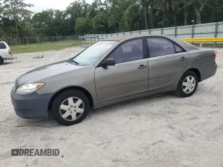2005 Toyota Camry STD z VIN JTDBE32K953034941, wystawiony jako Copart lot #59636685 z przebiegiem 212 167 mil mil oraz Czysty tytuł • Clean title. Historia ofert i sprzedaży dostępna na DreamBid. Obrazek 1.